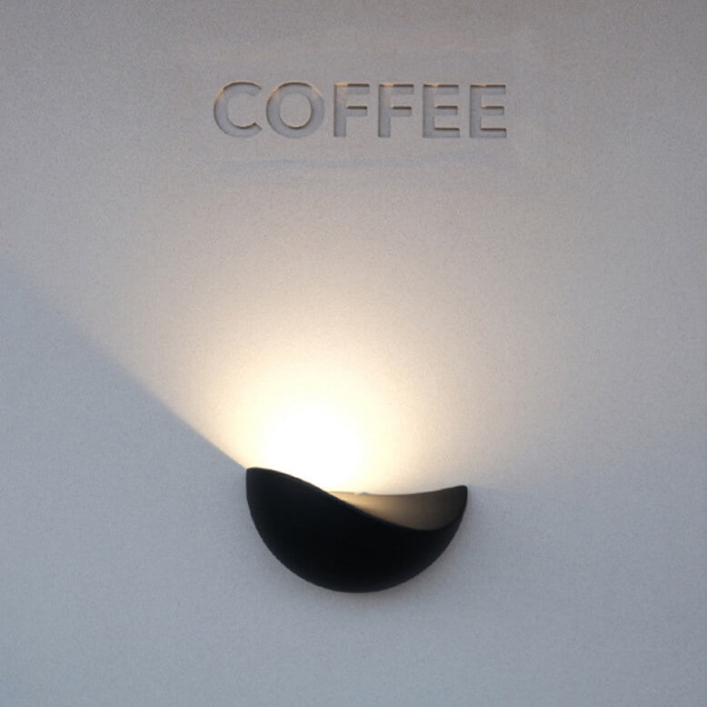Wall-mounted light fixture with 'COFFEE' text on a light gray background