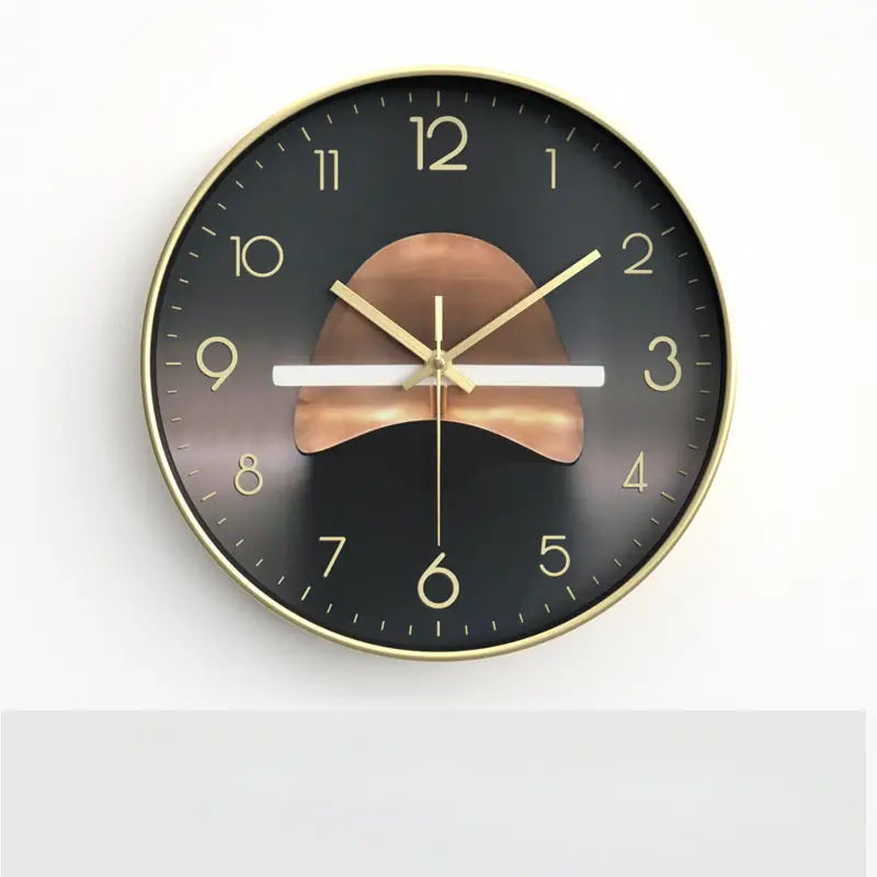 Round wall clock with gold and bronze design on a white background