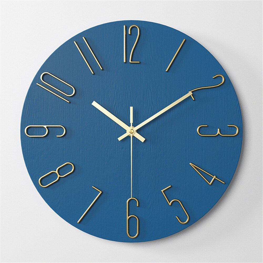 Blue wall clock with gold hands and numbers on a light gray background
