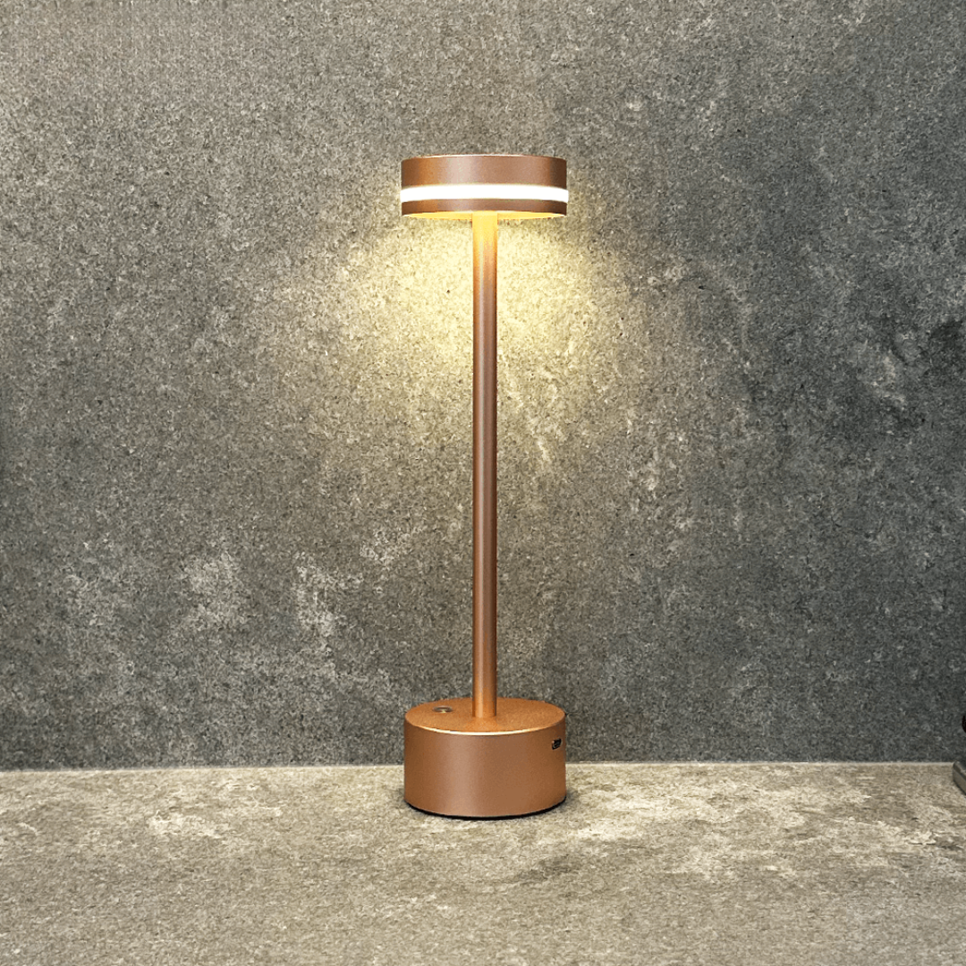 Brown outdoor lamp with a light on against a gray wall