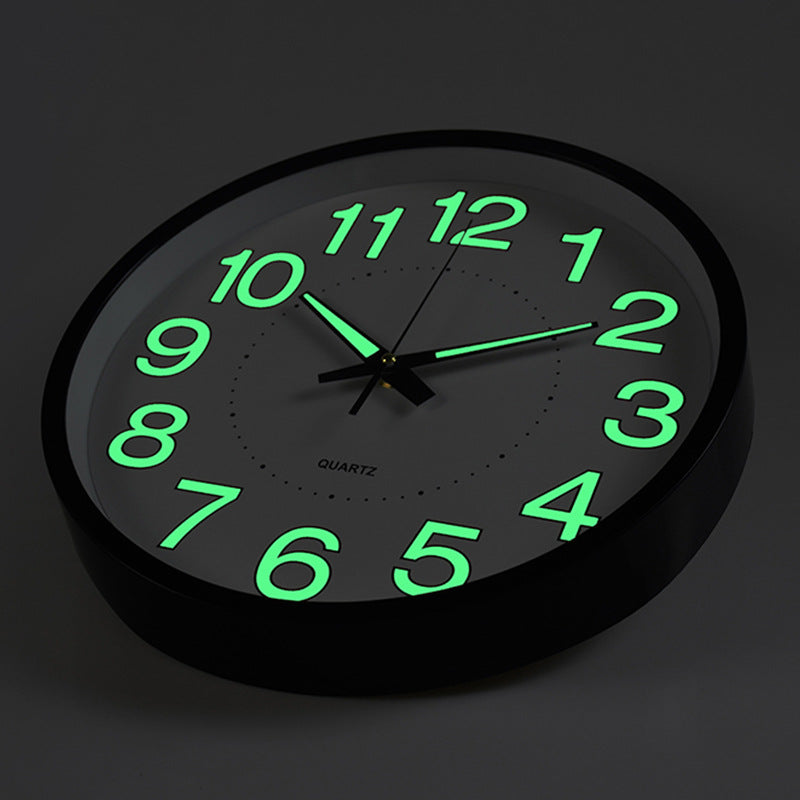 Wall clock with green glowing numbers on a black background