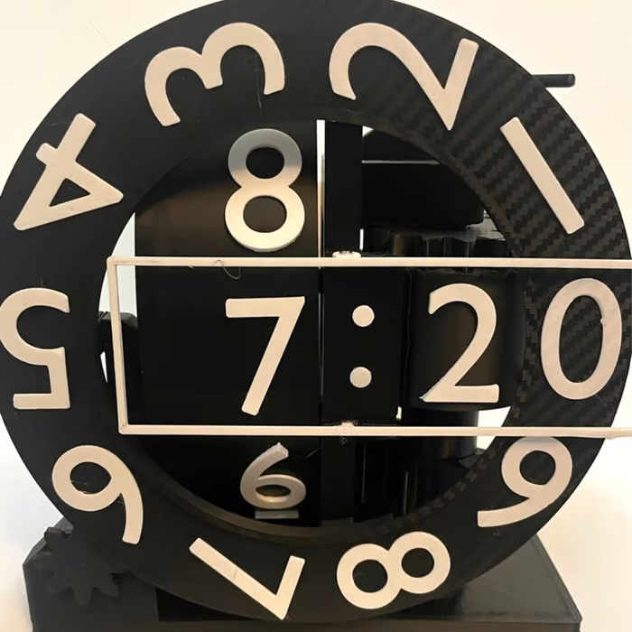 Black and beige clock with a transparent face showing the time.