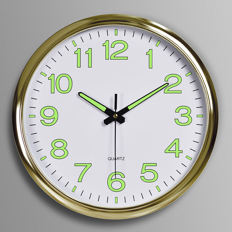 Wall clock with gold frame and green glowing numbers on a gray background