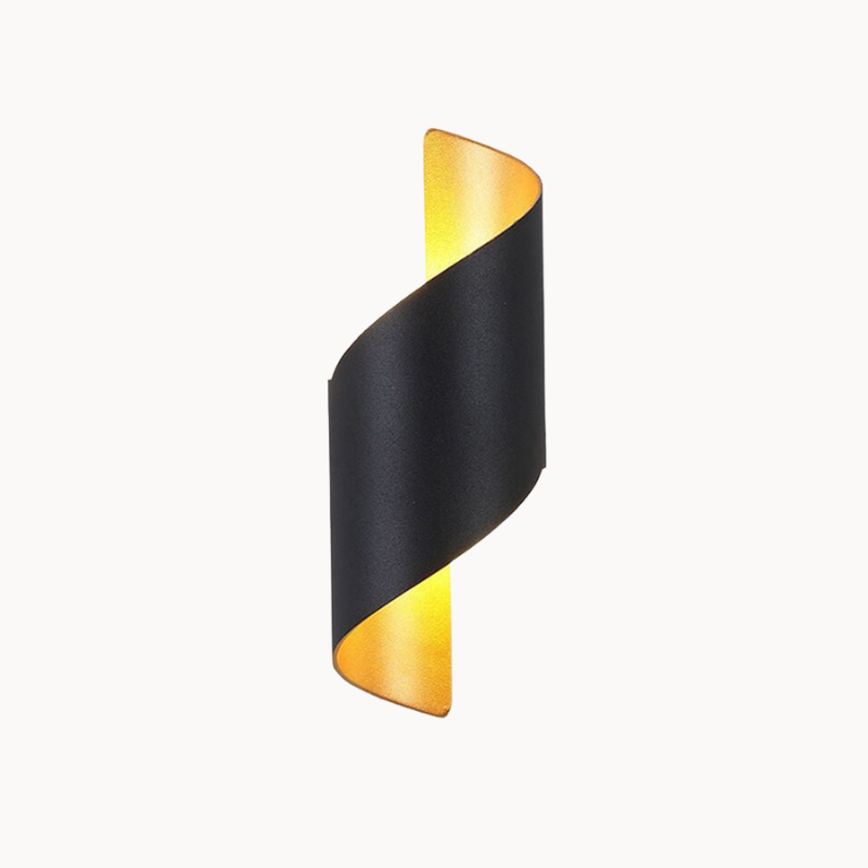 Black and gold wall sconce on a beige background