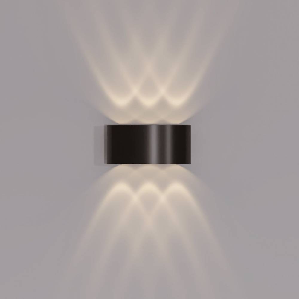 Modern wall-mounted light fixture on a gray background