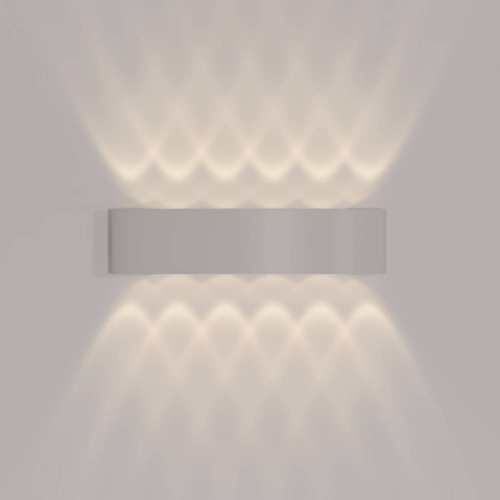 Rectangular wall light fixture casting a soft glow on a gray wall