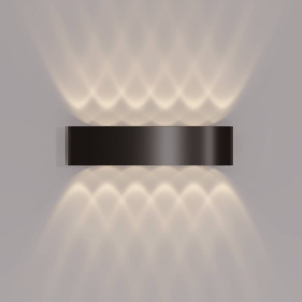 Wall-mounted light fixture with a black base and glass shade on a gray background