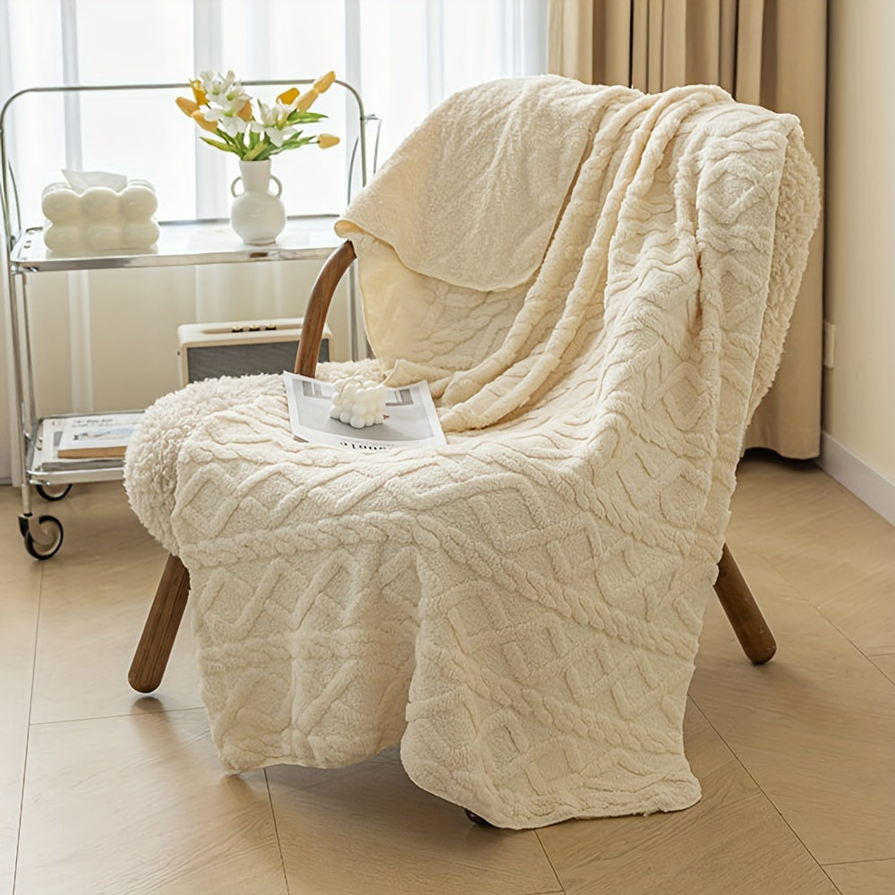 Beige textured blanket draped over a wooden chair in a room with a window and small table.