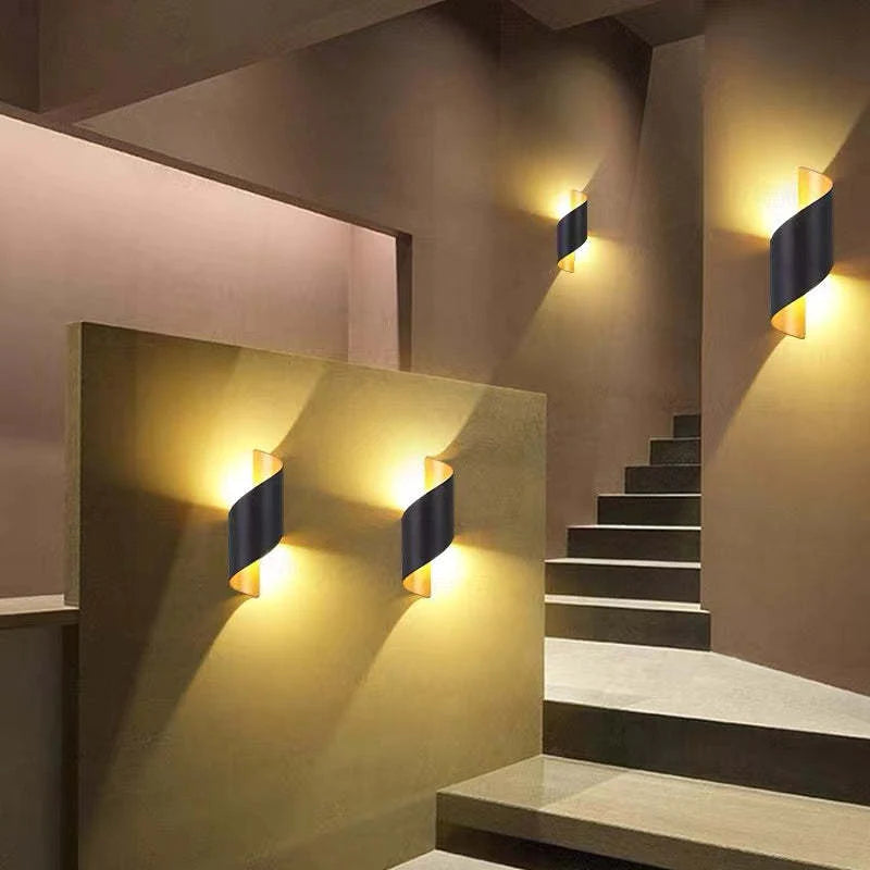 Staircase with wall-mounted lights in a modern interior setting
