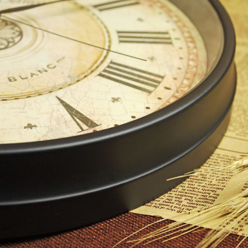 Close-up of a vintage-style clock face with Roman numerals on a textured surface.