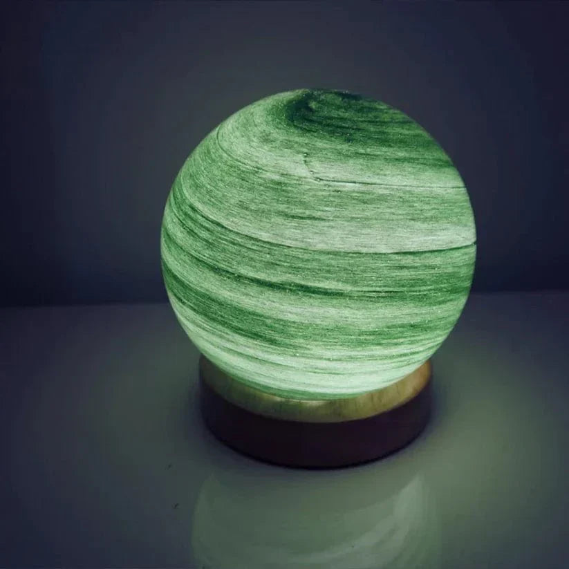 Green marble-patterned lamp on a dark background