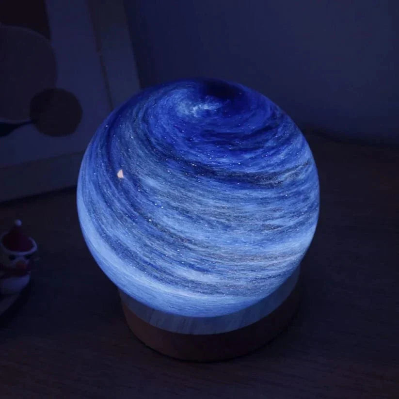 Blue glowing spherical light in a dark room