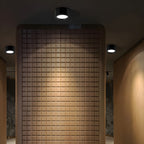 Tiled wall with recessed lighting in a modern interior setting