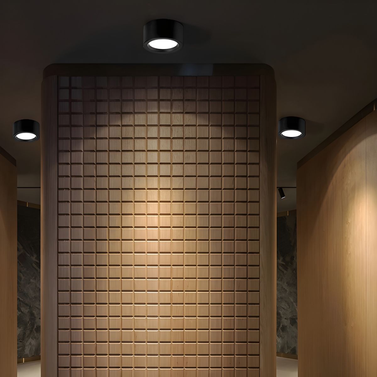 Tiled wall with recessed lighting in a modern interior setting