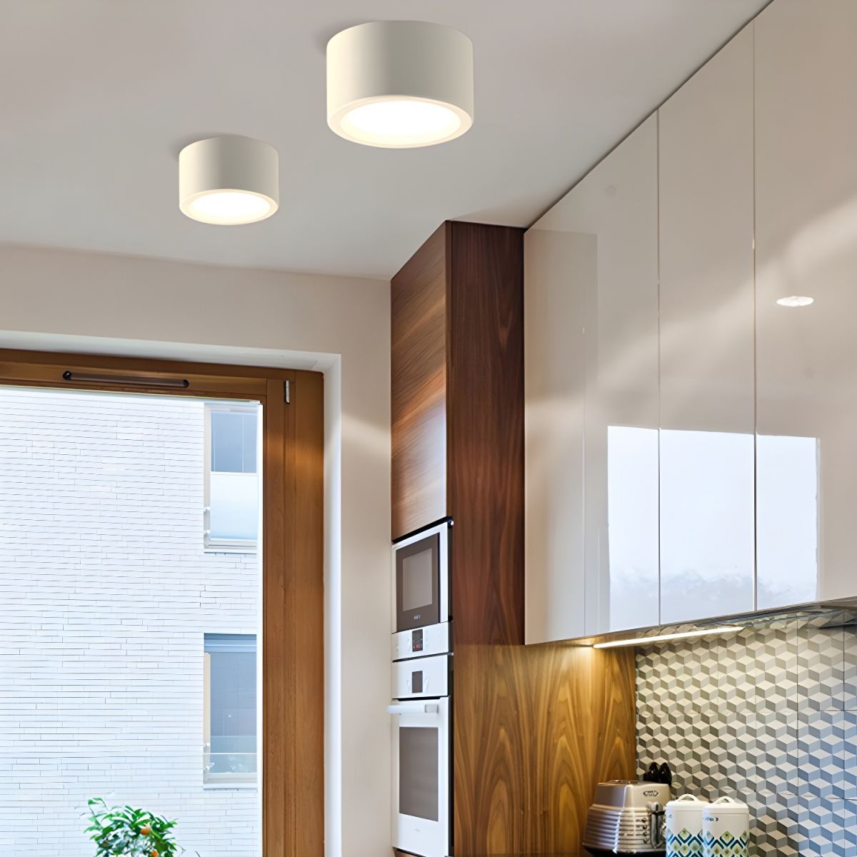 Modern kitchen interior with wooden cabinets, white appliances, and a window.