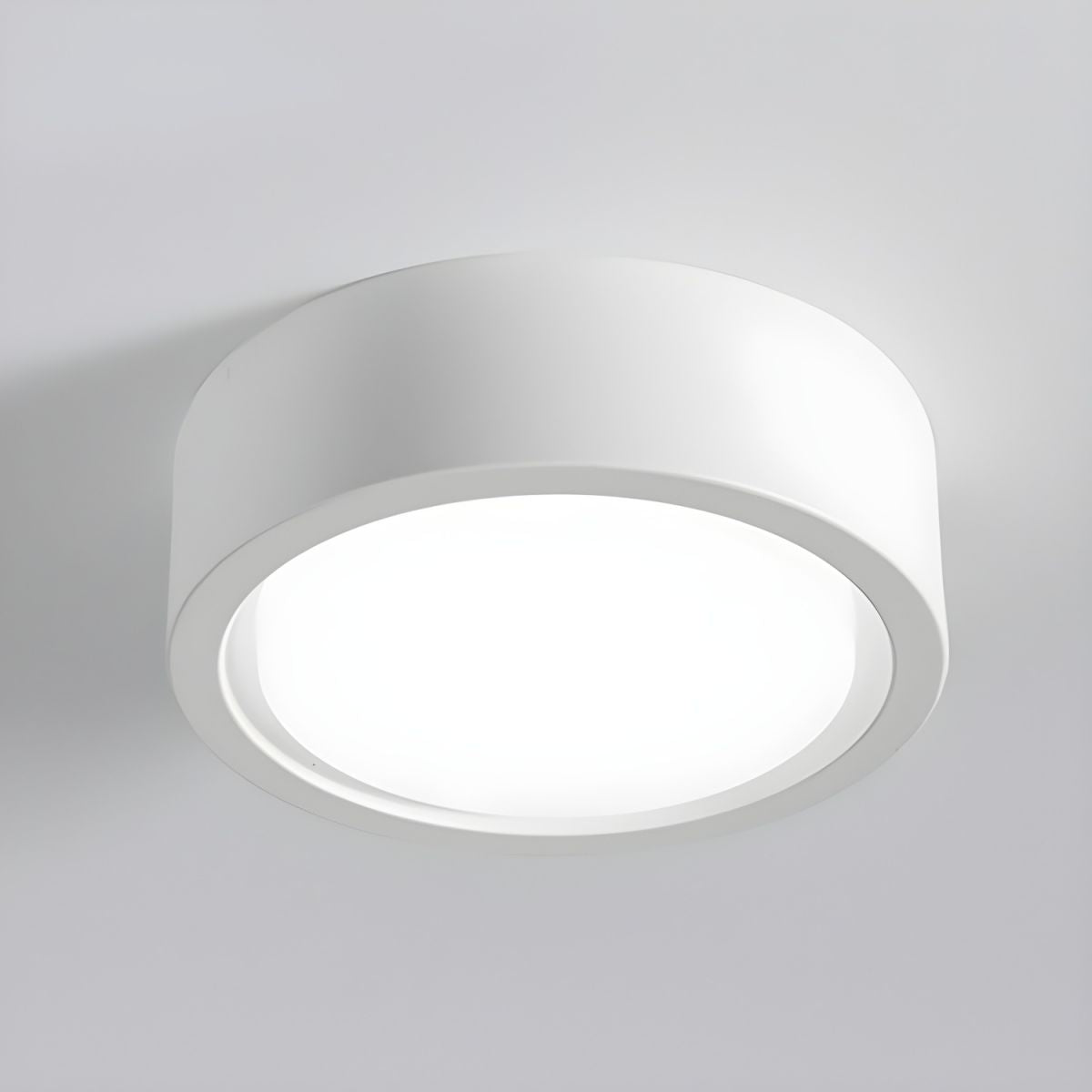 Round ceiling light fixture on a gray background