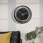 Black and white wall clock on a light background