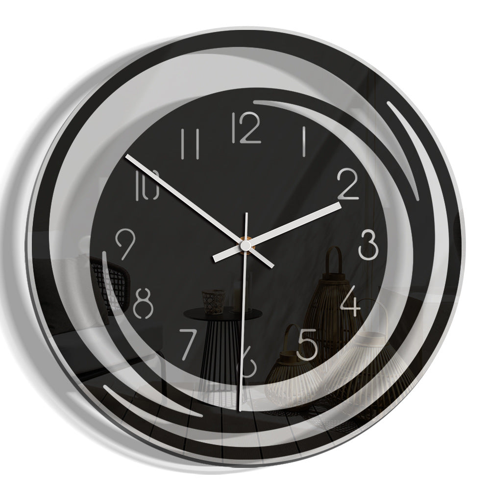 Wall clock with black face and silver frame on a white background