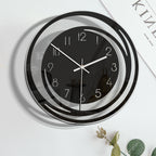 Black and white wall clock on a light background