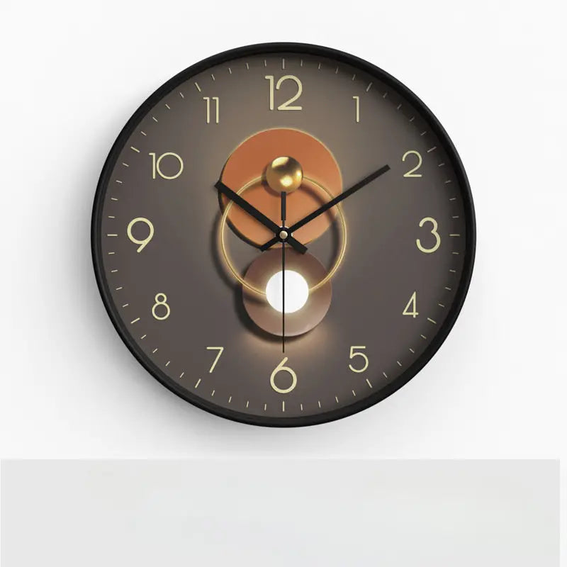 Round wall clock with a brown and gold design on a white background