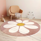 Round flower-shaped rug with a yellow center on a wooden floor, next to a beige armchair.
