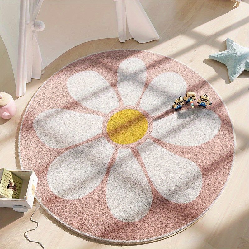 Round rug with a flower design on a wooden floor