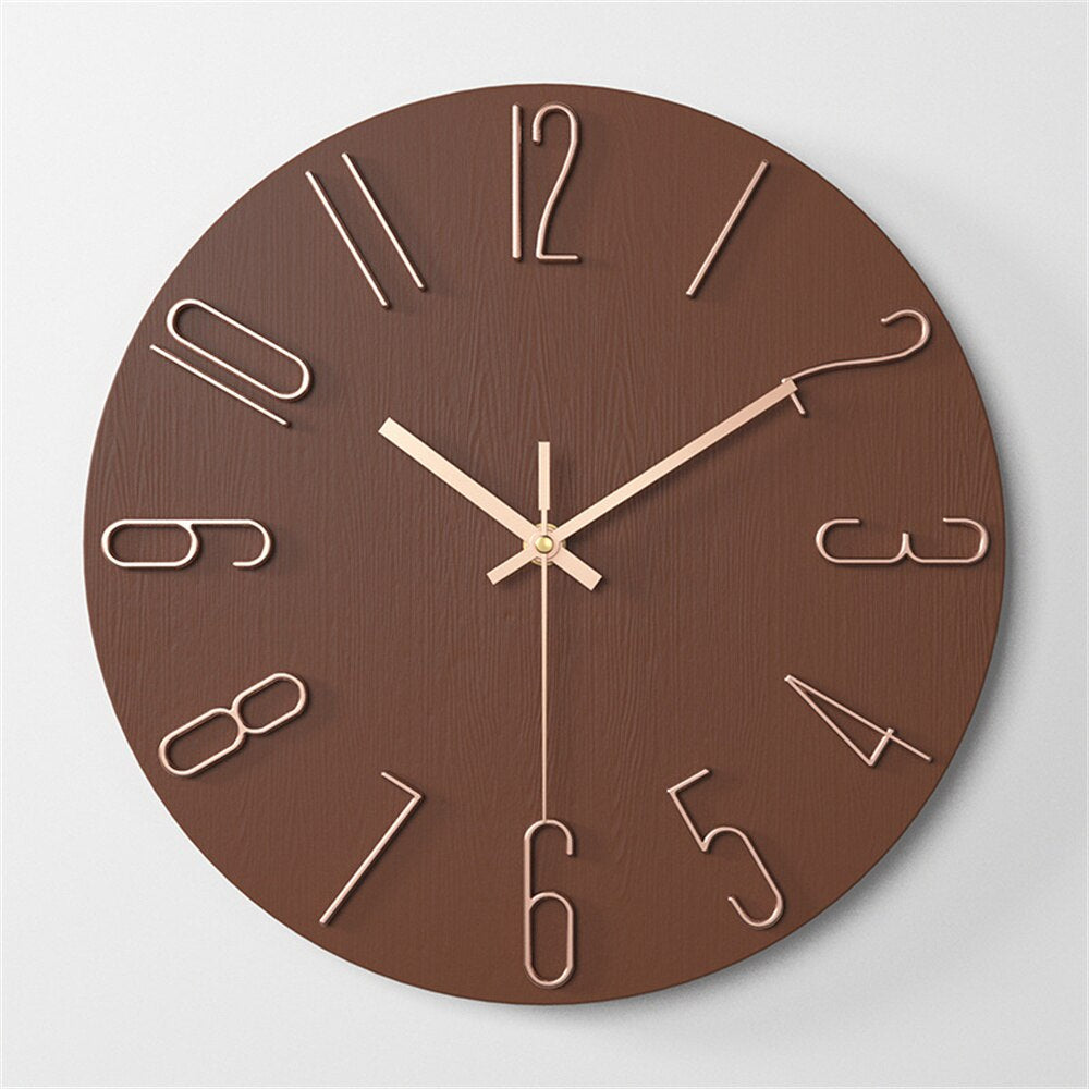 Wooden wall clock with brown face and gold hands on a light gray background