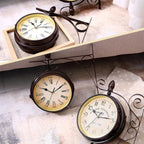 Set of three vintage-style wall clocks on a surface with a neutral background
