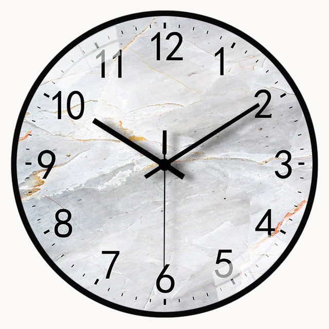 Round wall clock with marble design on a white background