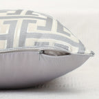 Gray pillow with geometric pattern on a white background