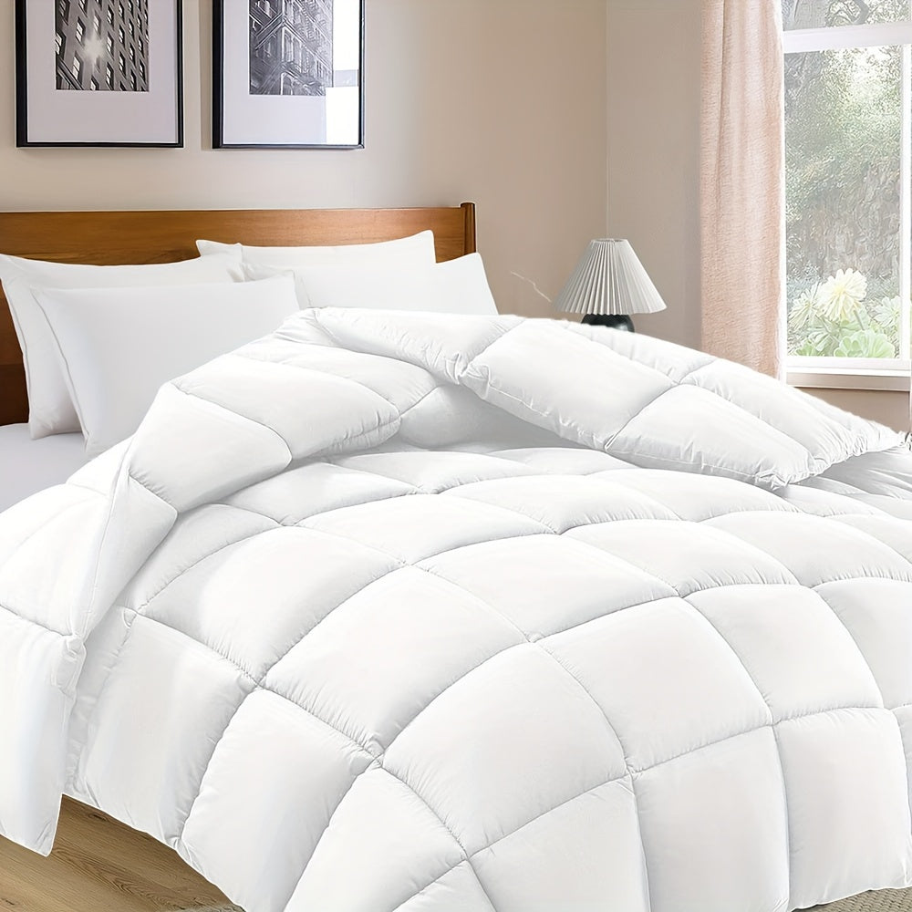 White comforter on a bed in a bedroom setting with a lamp and window.