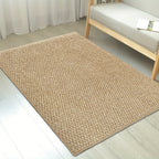 Beige woven rug on a light wooden floor with a chair in the background