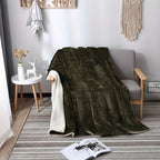 Green blanket draped over a chair in a room with decor elements.