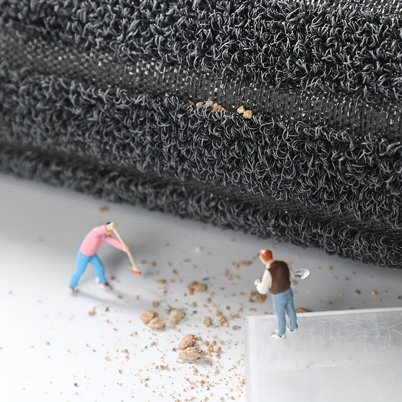 Two small figures standing on a textured surface with a close-up of the material above them.