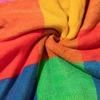Close-up of colorful fabric with red, yellow, green, and blue stripes.
