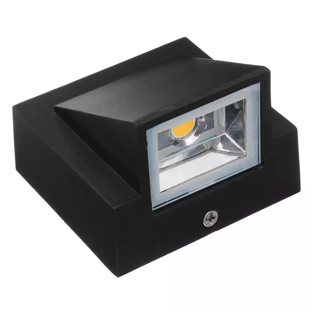 Black outdoor light fixture on a white background