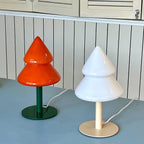 Two unique table lamps with cone-shaped designs on a flat surface.