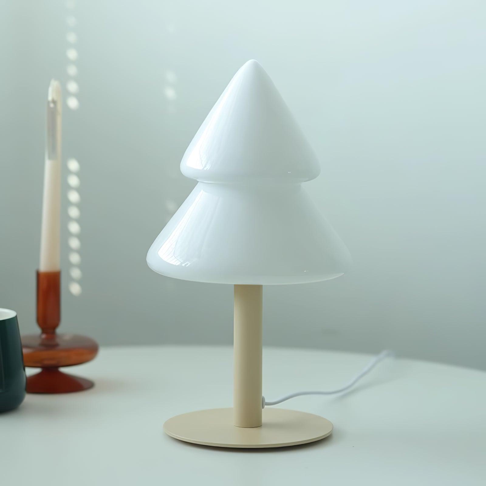 White table lamp with a wooden base on a white surface.