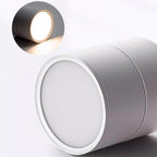 Cylindrical light fixture with a close-up inset showing the illuminated interior.