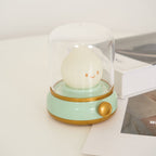 Small round lamp with a smiling face on a light green base