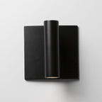 Black wall-mounted light fixture on a white background