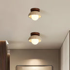 Two ceiling lights with wooden frames on a white ceiling.