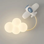 Children's wall lamp shaped like an airplane with cloud lights on a gray background