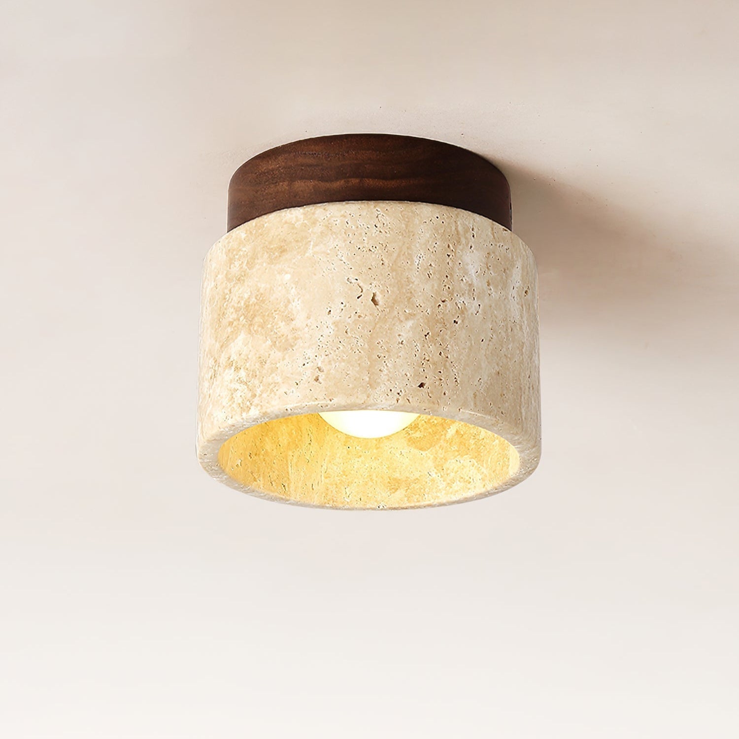 Ceiling light fixture with wooden top and beige stone base on a neutral background