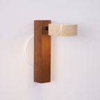 Modern wall lamp with wooden base and concrete-like shade