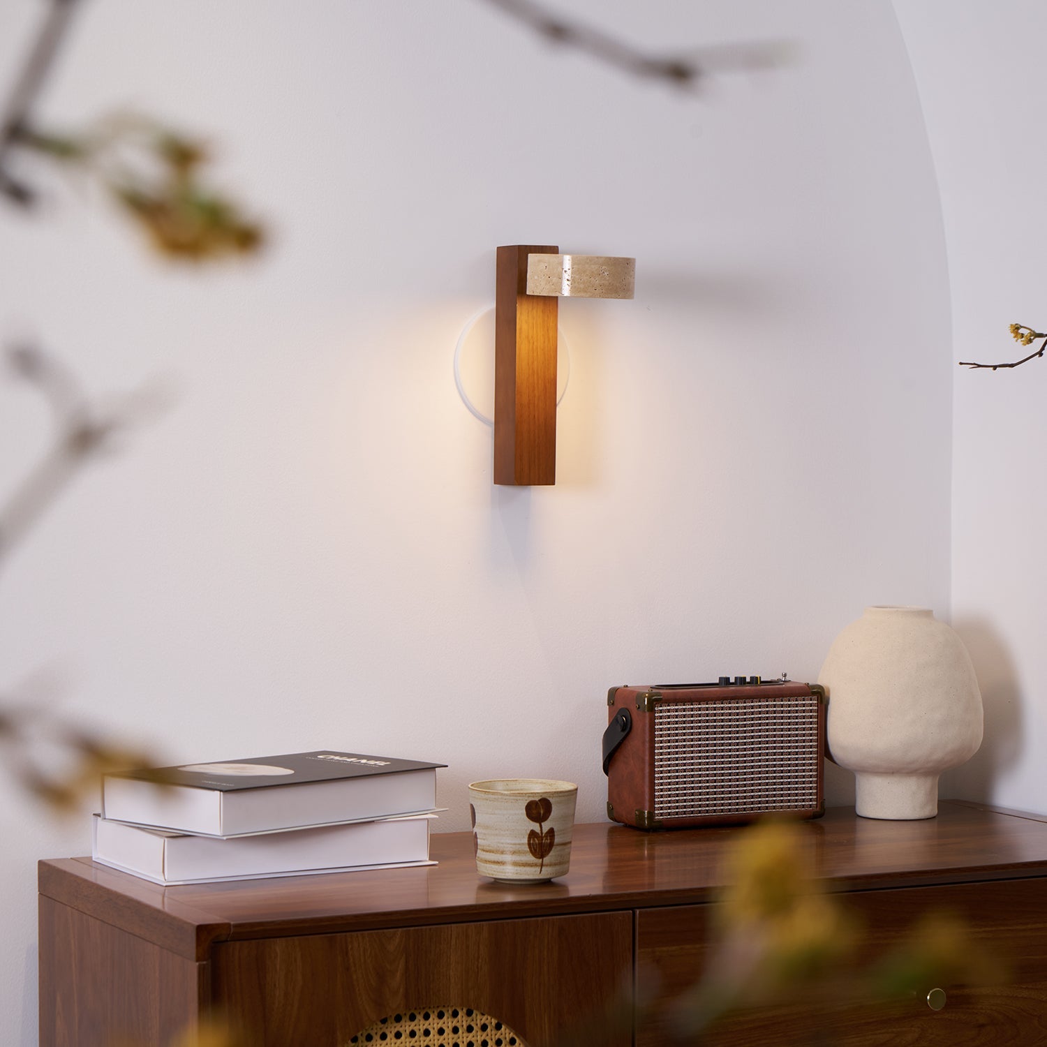 Modern wall lamp with wooden base and concrete-like shade