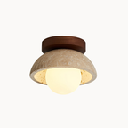 Ceiling light fixture with concrete-like shade and wooden top on a beige background