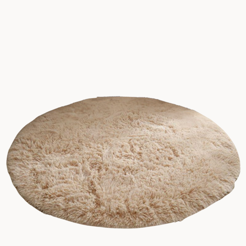 Round beige rug in a beige background