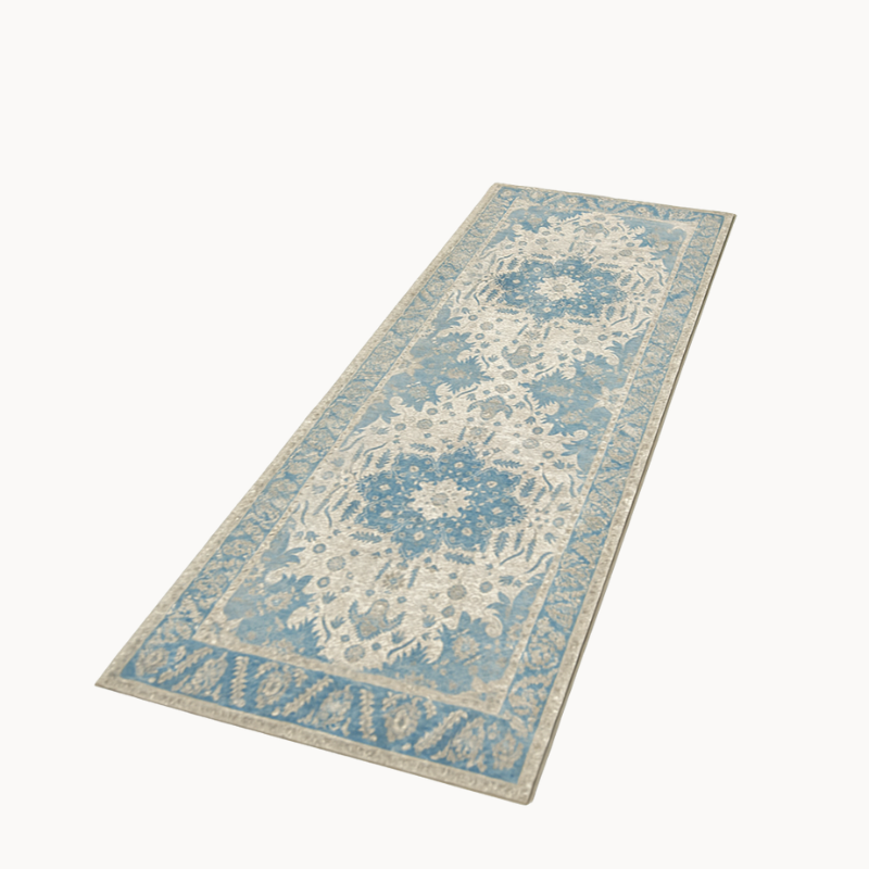 Decorative blue and beige runner rug on a beige background