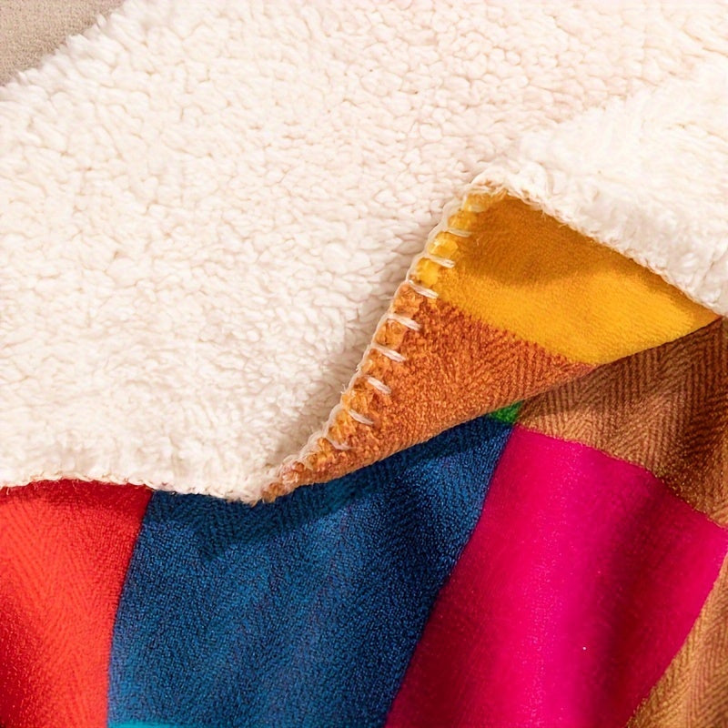 Close-up of a colorful fabric with a white textured surface underneath
